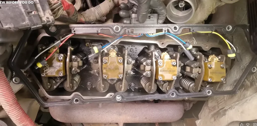 A heavy-duty valve cover gasket installed on top of the engine block to seal the camshafts.valve cover gasket