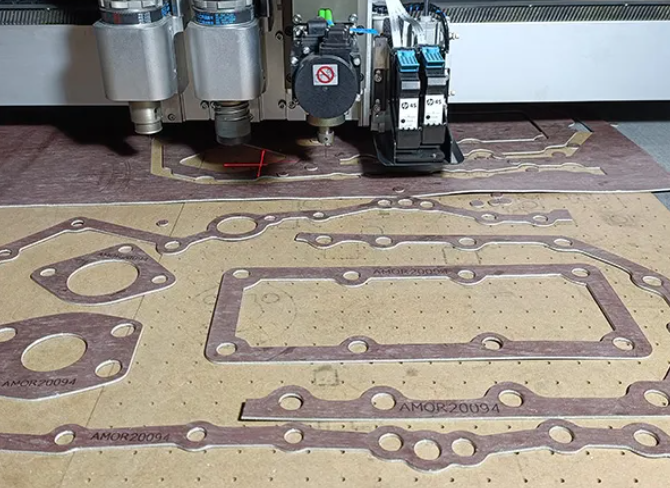 CNC precision manufacturing of a heavy duty engine overhaul gasket set.