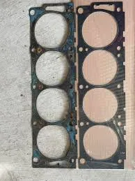 Comparing cheap paper gaskets to premium metal-core intake manifold gaskets.